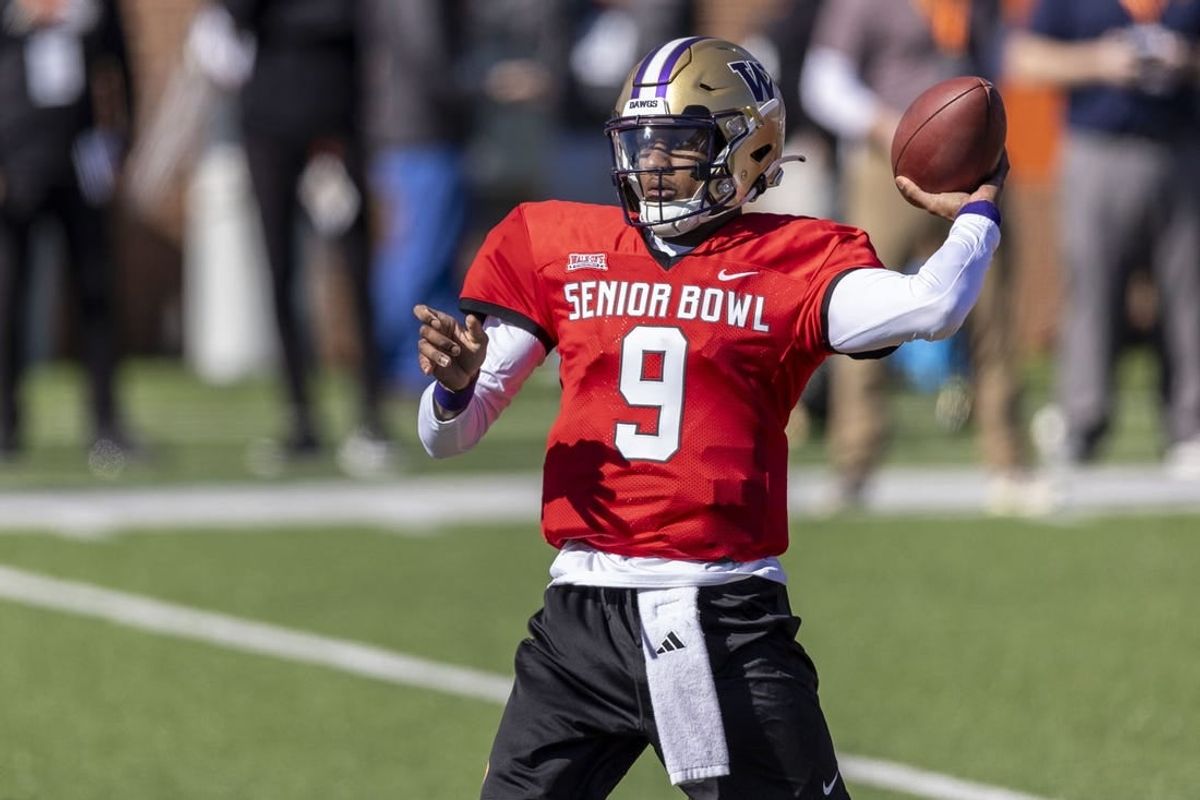 Jan 30, 2024; Mobile, AL, USA; National quarterback Michael Penix Jr. of Washington (9) throws the ball during practice for the National team at Hancock Whitney Stadium.