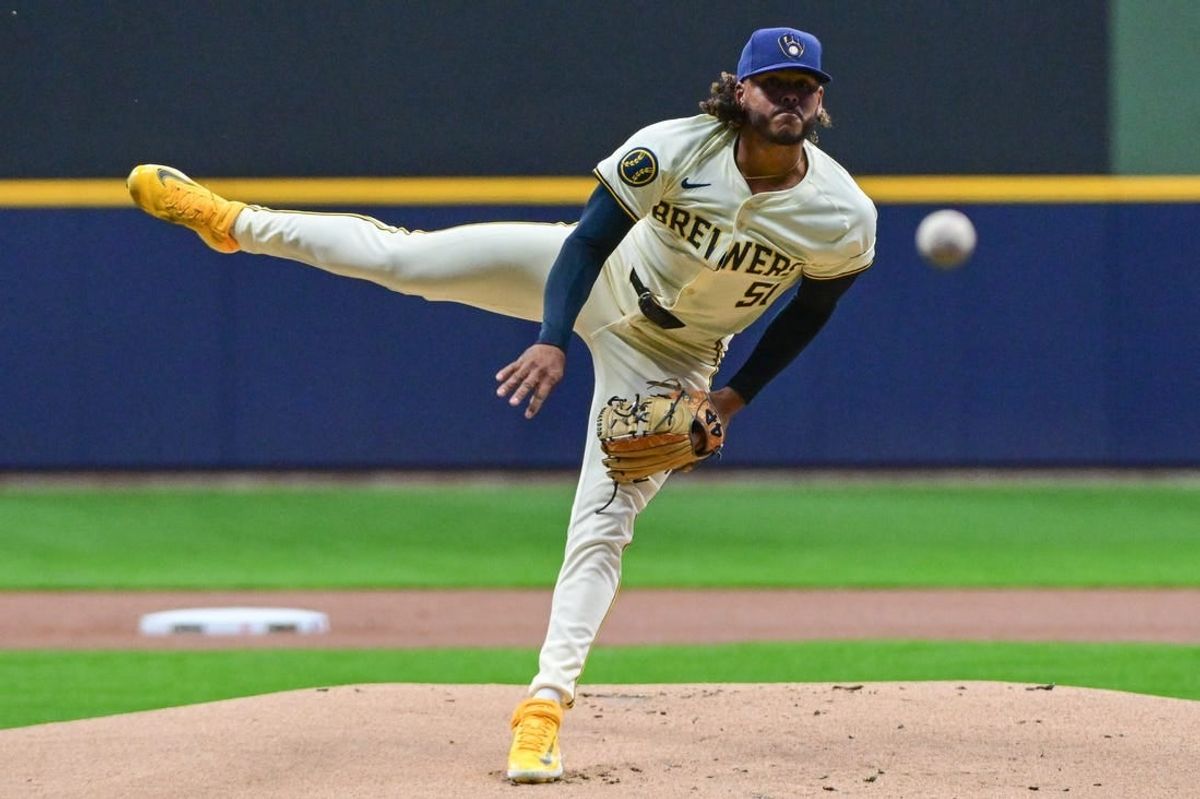 Apr 5, 2024; Milwaukee, Wisconsin, USA; Milwaukee Brewers pitcher Freddy Peralta (51) throws a pitch in the first inning against the Seattle Mariners at American Family Field.