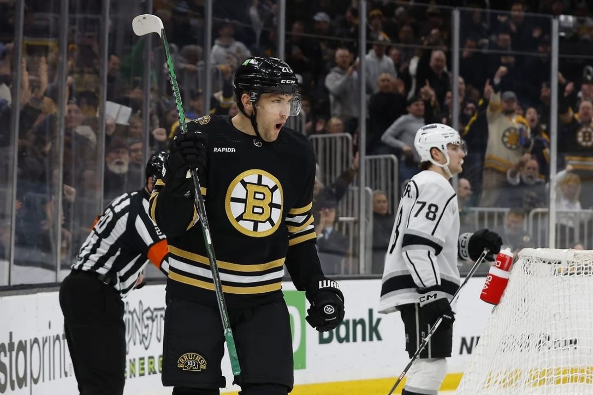 Feb 17, 2024; Boston, Massachusetts, USA; Boston Bruins left wing James van Riemsdyk (21) celebrates the first of his two goals during the first period as Los Angeles Kings right wing Alex Laferriere (78) skates away at TD Garden.