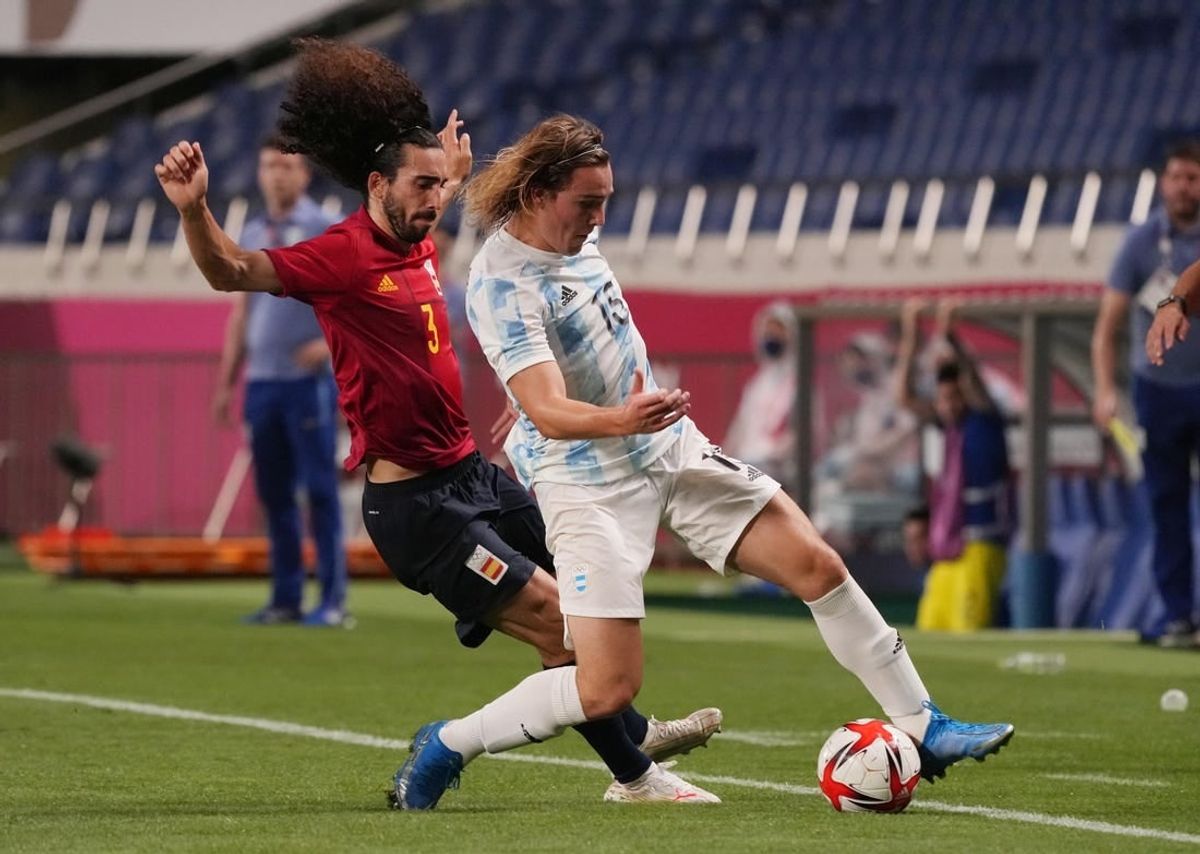 Jul 28, 2021; Saitama, Japan; Team Argentina forward Pedro de la Vega (15) battles for the ball with Team Spain defender Marc Cucurella (3) during the Tokyo 2020 Olympic Summer Games at Saitama Stadium.