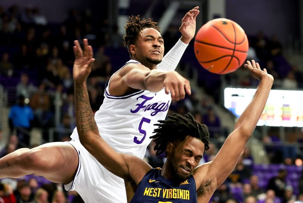 Feb 12, 2024; Fort Worth, Texas, USA;  TCU Horned Frogs forward Chuck O'Bannon Jr. (5) defends the shot of West Virginia Mountaineers guard Jeremiah Bembry (5) during the second half at Ed and Rae Schollmaier Arena.