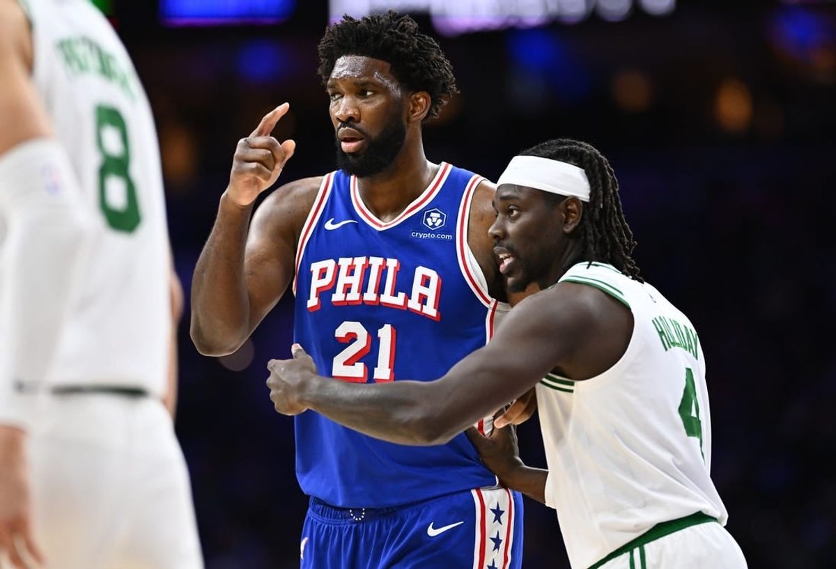 Nov 8, 2023; Philadelphia, Pennsylvania, USA; Boston Celtics guard Jrue Holiday (4) defends Philadelphia 76ers center Joel Embiid (21) in the third quarter at Wells Fargo Center.
