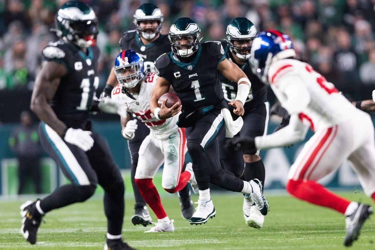 Dec 25, 2023; Philadelphia, Pennsylvania, USA; Philadelphia Eagles quarterback Jalen Hurts (1) runs with the ball against the New York Giants during the second quarter at Lincoln Financial Field.