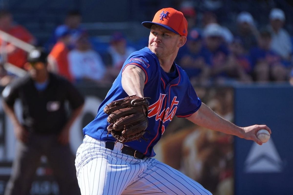 Feb 25, 2024; Port St. Lucie, Florida, USA;  New York Mets pitcher Tyler Jay pitches against the Houston Astros in the seventh inning against the Houston Astros at Clover Park.