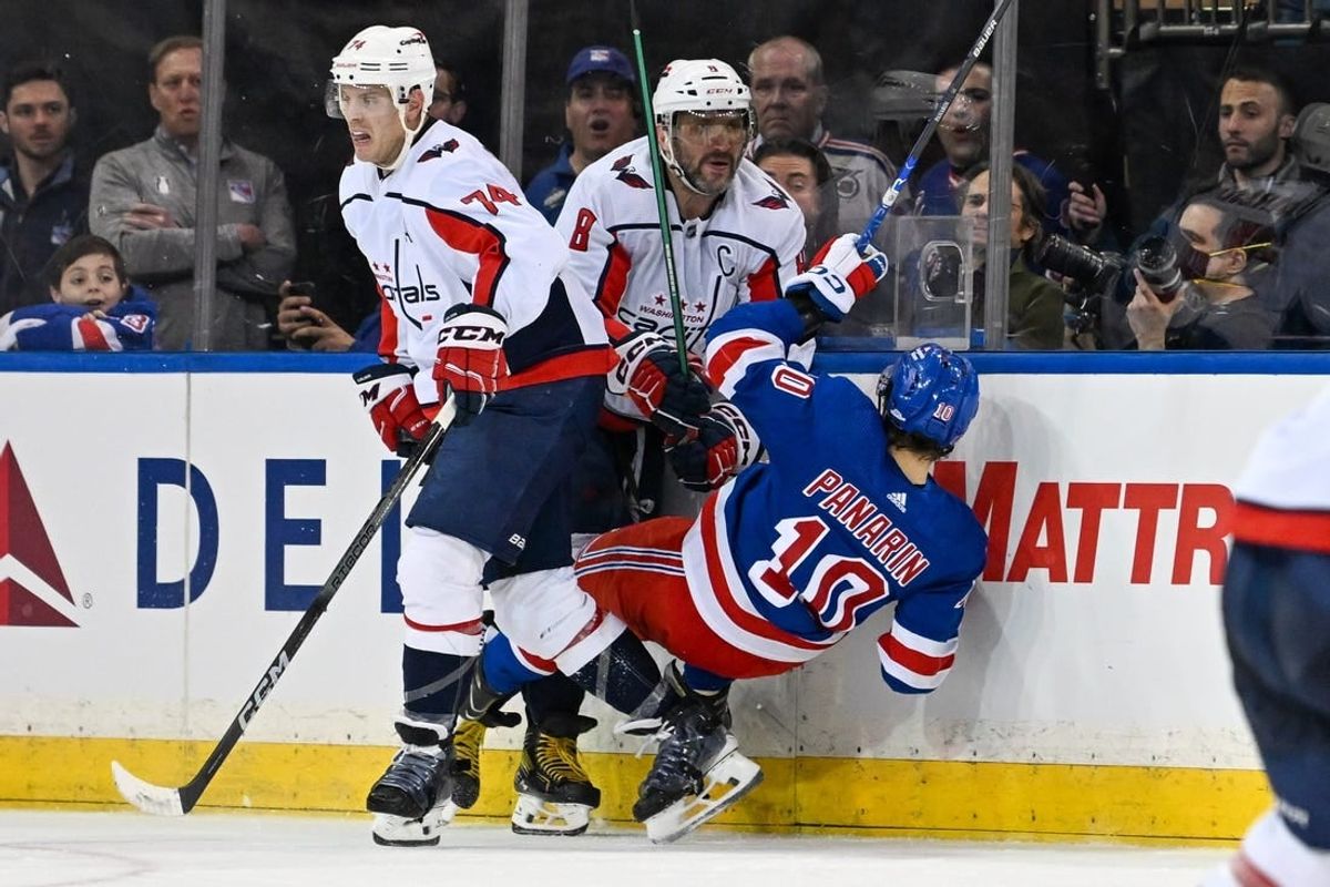 Apr 23, 2024; New York, New York, USA;  Washington Capitals left wing Alex Ovechkin (8) checks New York Rangers left wing Artemi Panarin (10) during the third period in game two of the first round of the 2024 Stanley Cup Playoffs at Madison Square Garden.