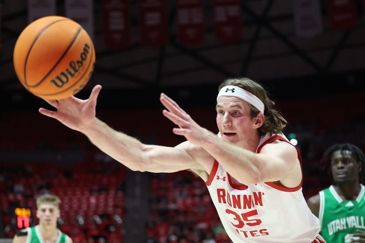 Dec 16, 2023; Salt Lake City, Utah, USA; Utah Utes center Branden Carlson (35) reaches for a rebound against the Utah Valley Wolverines during the second half at Jon M. Huntsman Center.