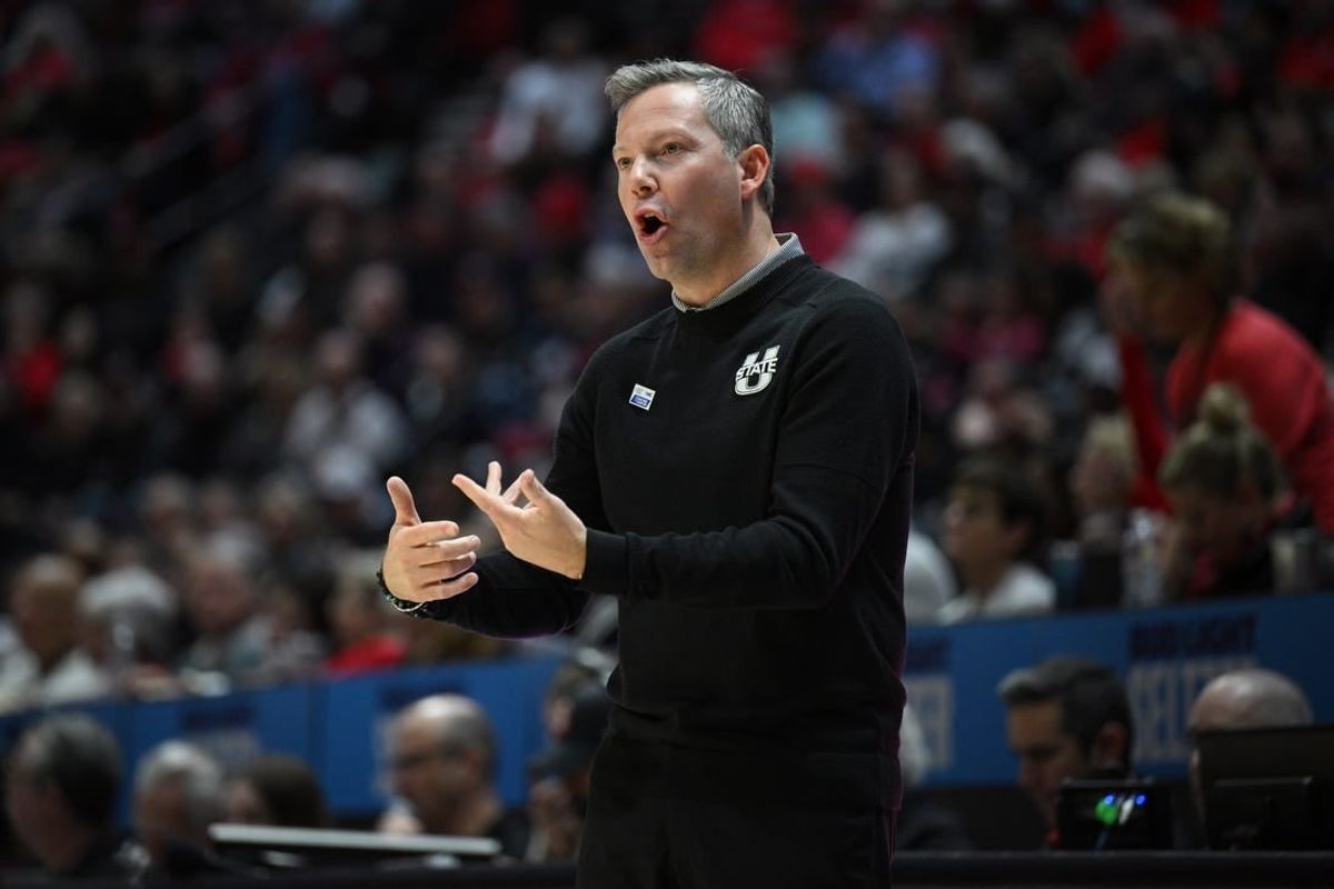 Jan 25, 2023; San Diego, California, USA; Utah State Aggies head coach Ryan Odom gestures from the sideline during the first half against the San Diego State Aztecs at Viejas Arena.