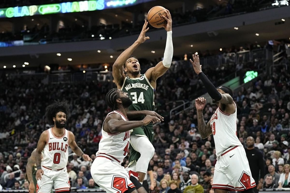 Dec 11, 2023; Milwaukee, Wisconsin, USA;  Milwaukee Bucks forward Giannis Antetokounmpo (34) shoots over Chicago Bulls forward Patrick Williams (44) during the fourth quarter at Fiserv Forum.