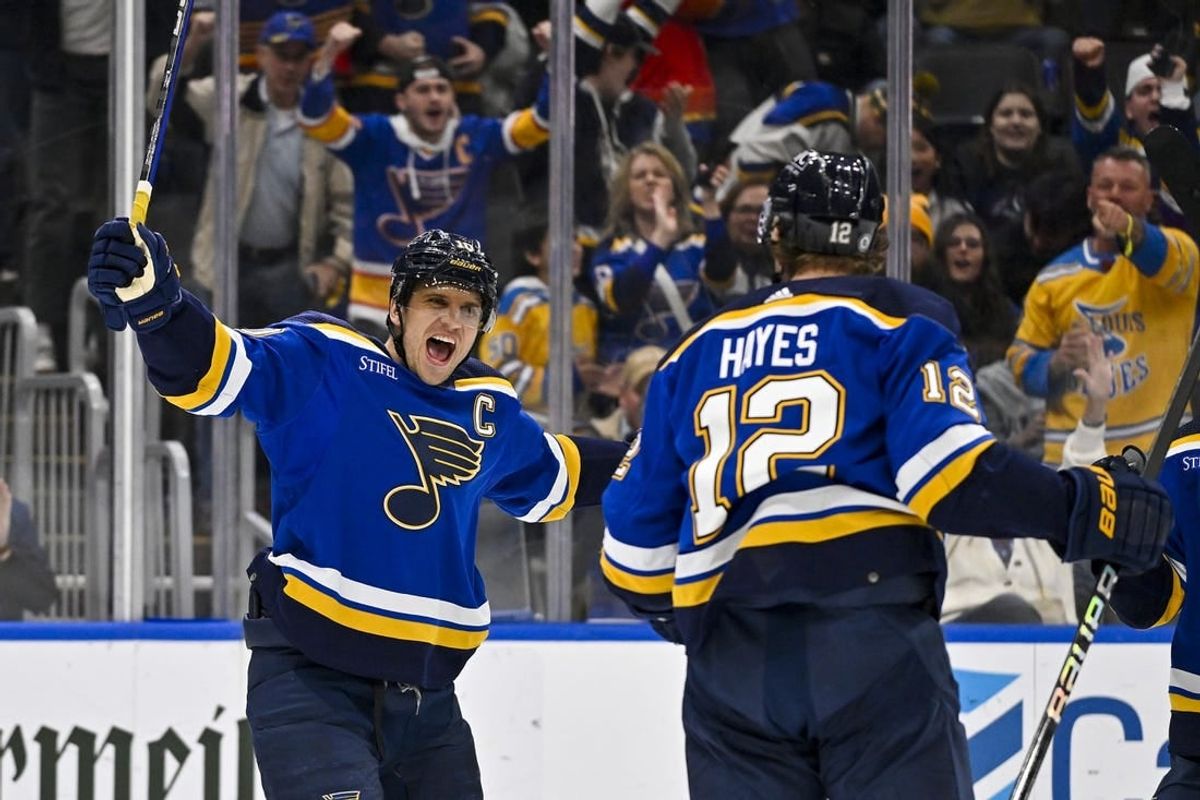 Nov 30, 2023; St. Louis, Missouri, USA;  St. Louis Blues right wing Kevin Hayes (12) is congratulated by center Brayden Schenn (10) after scoring against the Buffalo Sabres during the second period at Enterprise Center.