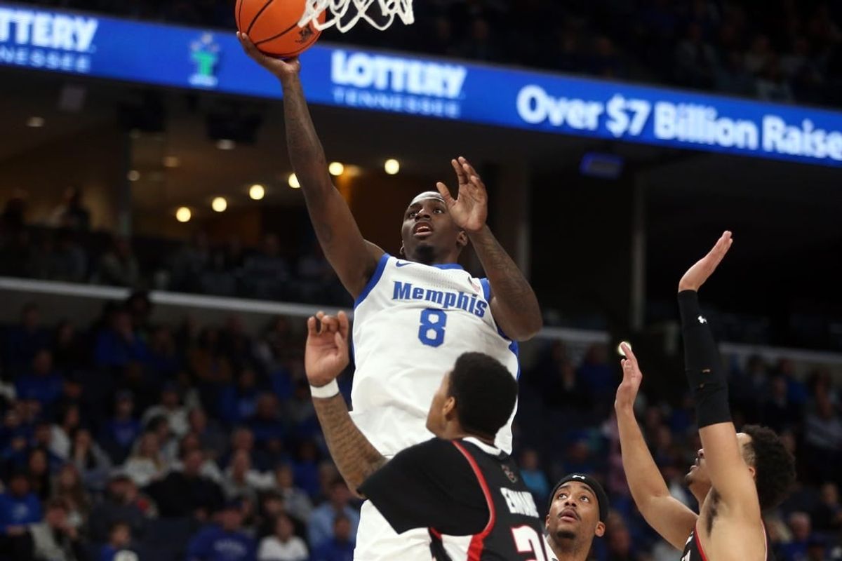 Dec 30, 2023; Memphis, Tennessee, USA; Memphis Tigers forward David Jones (8) shoots during the first half against the Austin Peay Governors at FedExForum.