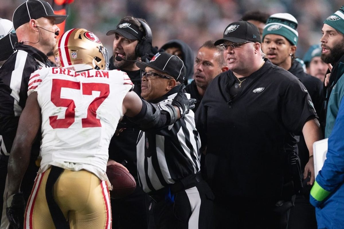 Dec 3, 2023; Philadelphia, Pennsylvania, USA; San Francisco 49ers linebacker Dre Greenlaw (57) has an altercation with Philadelphia Eagles staff member Dom DiSandro during the third quarter at Lincoln Financial Field.