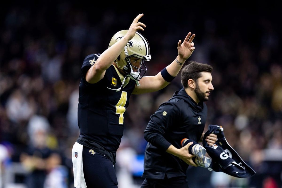 Jan 7, 2024; New Orleans, Louisiana, USA;  New Orleans Saints quarterback Derek Carr (4) reacts to a touchdown against the Atlanta Falcons during the first half at Caesars Superdome.
