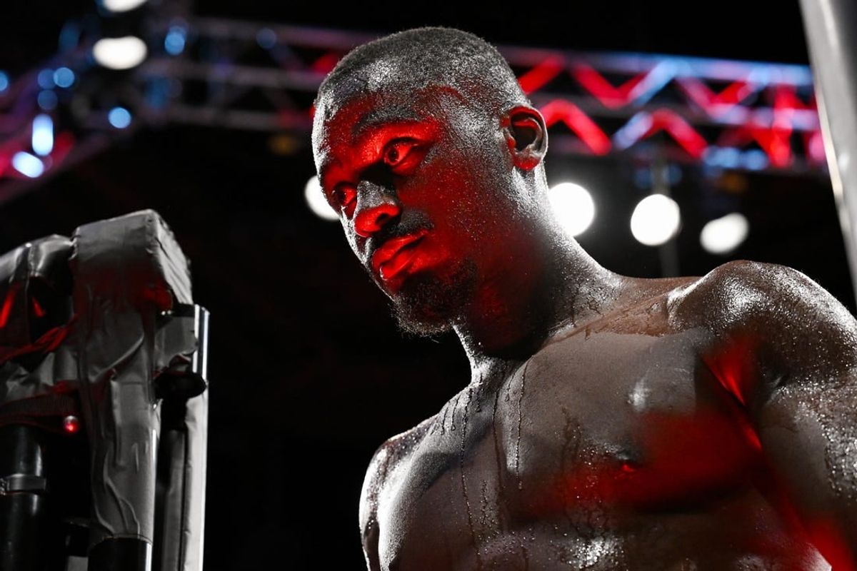 Sep 2, 2023; Paris, France; William Gomis (red gloves) celebrates defeating Yanis Ghemmouri (blue gloves) during UFC Fight Night at Accor Arena.