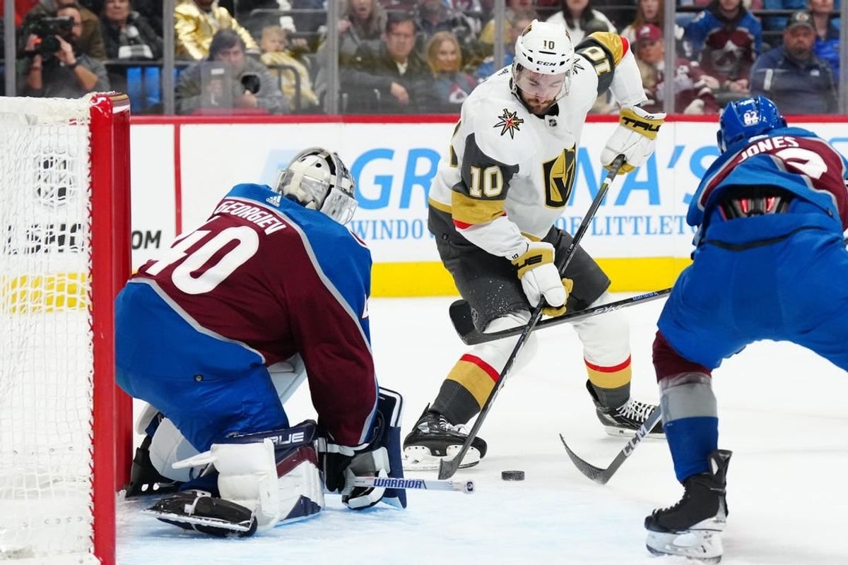 Jan 10, 2024; Denver, Colorado, USA; Vegas Golden Knights center Nicolas Roy (10) shoots the puck in Colorado Avalanche goaltender Alexandar Georgiev (40) in the first period at Ball Arena.