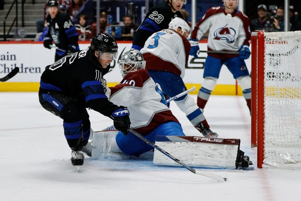 Feb 24, 2024; Denver, Colorado, USA; Colorado Avalanche goaltender Alexandar Georgiev (40) makes a save against Toronto Maple Leafs right wing Mitchell Marner (16) in the first period at Ball Arena.