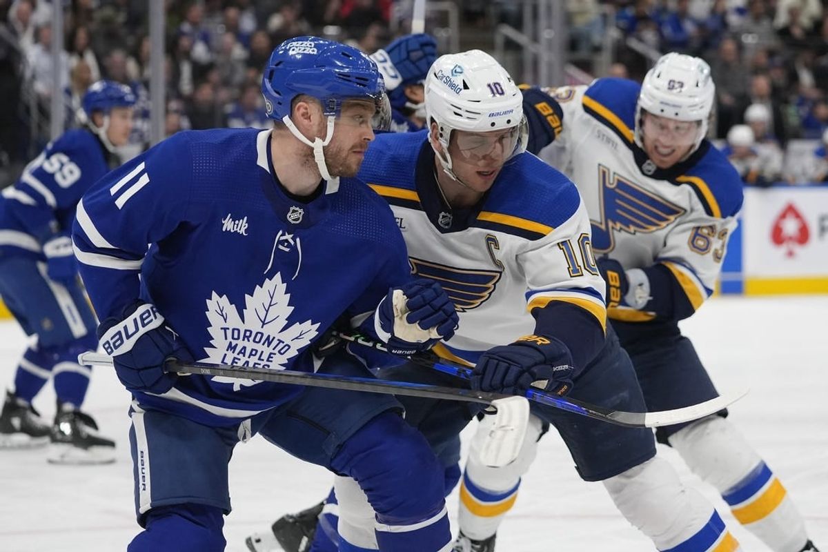 Feb 13, 2024; Toronto, Ontario, CAN; Toronto Maple Leafs forward Max Domi (11) and St. Louis Blues forward Brayden Schenn (10) battle for position during the second period Scotiabank Arena.