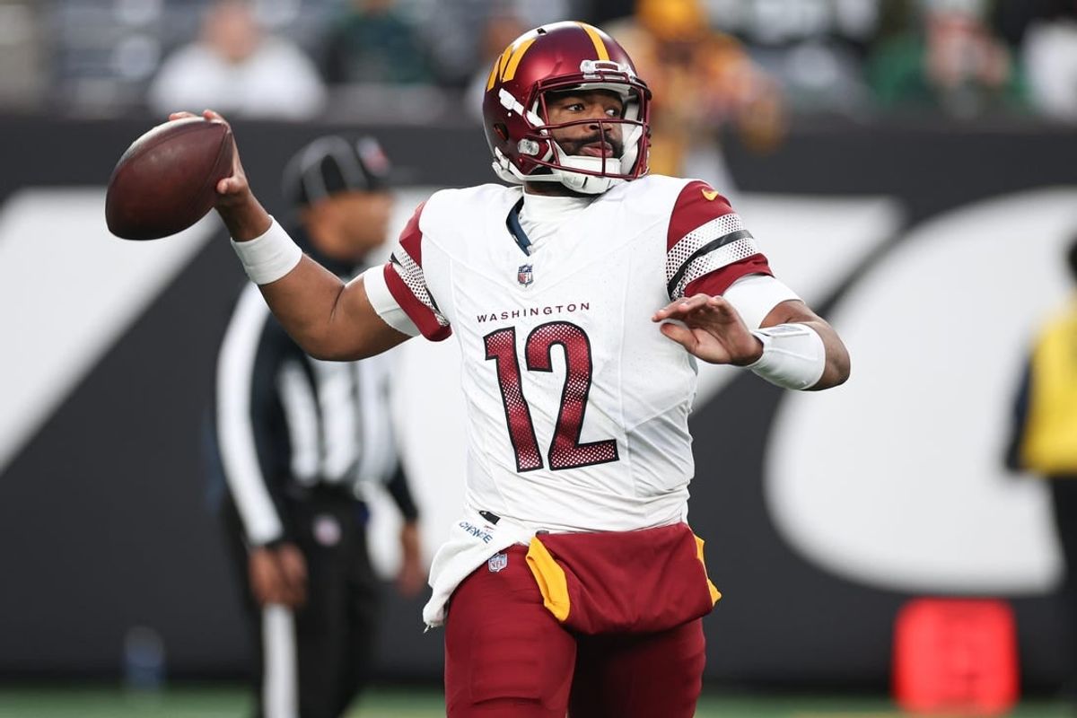 Dec 24, 2023; East Rutherford, New Jersey, USA; Washington Commanders quarterback Jacoby Brissett (12) throws the ball during the second half against the New York Jets at MetLife Stadium.