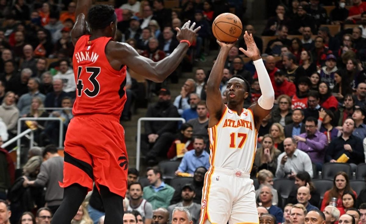 Dec 13, 2023; Toronto, Ontario, CAN;   Atlanta Hawks forward Onyeka Okongwu (17) shoots the ball as Toronto Raptors forward Pascal Siakam (43) defends in the first half at Scotiabank Arena.