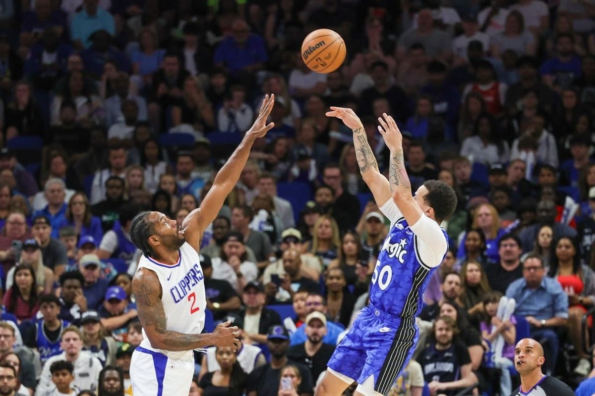 Mar 29, 2024; Orlando, Florida, USA; Orlando Magic guard Cole Anthony (50) shoots the ball over LA Clippers forward Kawhi Leonard (2) during the second half at KIA Center.