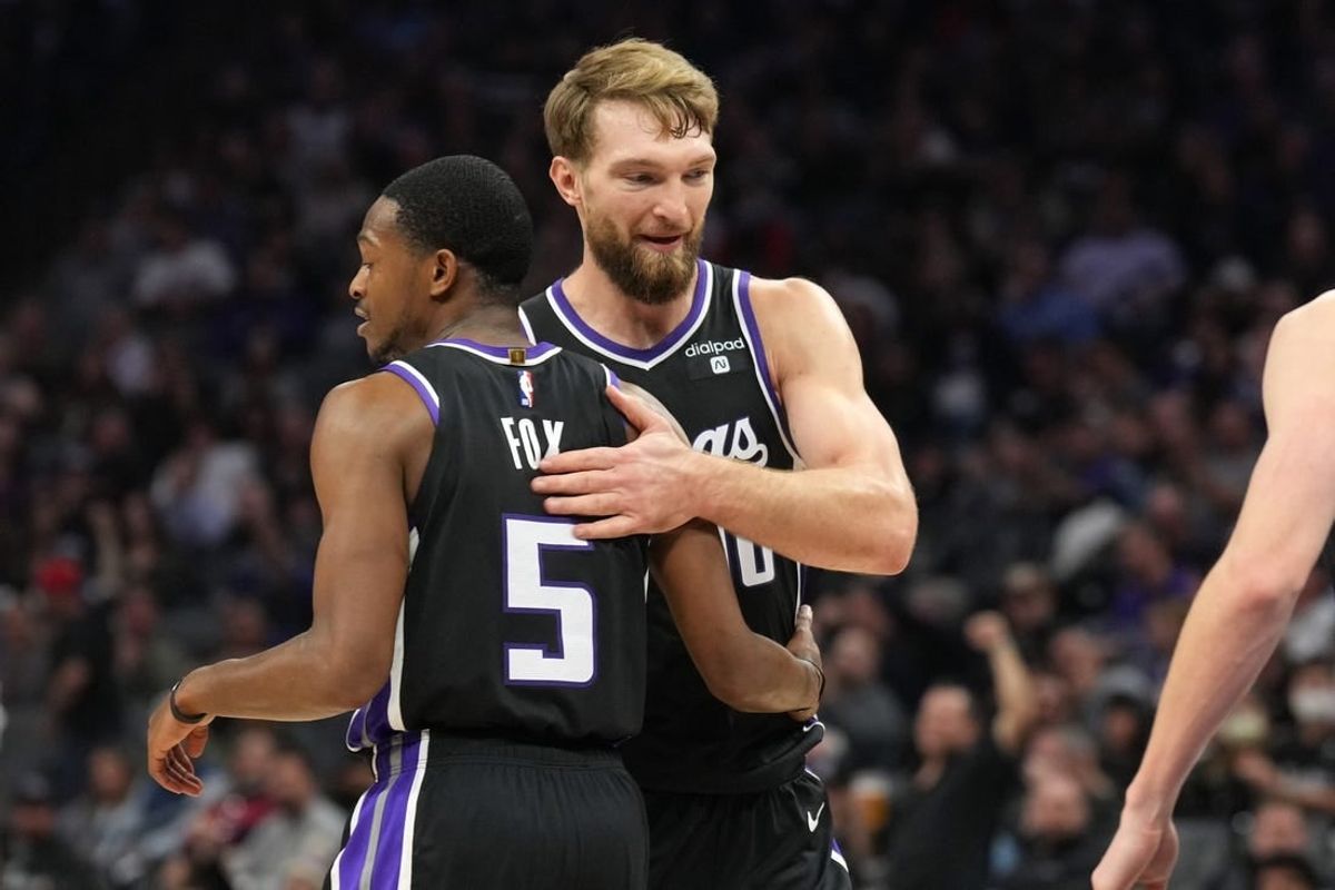 Dec 14, 2023; Sacramento, California, USA; Sacramento Kings guard De'Aaron Fox (5) is congratulated by forward Domantas Sabonis (10) after a basket against the Oklahoma City Thunder during the second quarter at Golden 1 Center.