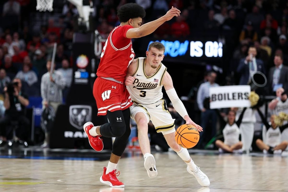 Mar 16, 2024; Minneapolis, MN, USA; Purdue Boilermakers guard Braden Smith (3) works up the court as Wisconsin Badgers guard Chucky Hepburn (23) defends during the first half at Target Center.