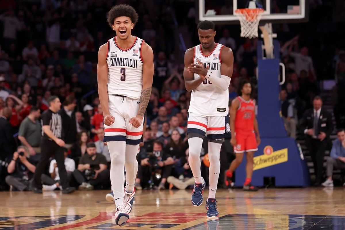 Mar 15, 2024; New York City, NY, USA; Connecticut Huskies forwards Jaylin Stewart (3) and Samson Johnson (35) react during the first half against the St. John's Red Storm at Madison Square Garden.