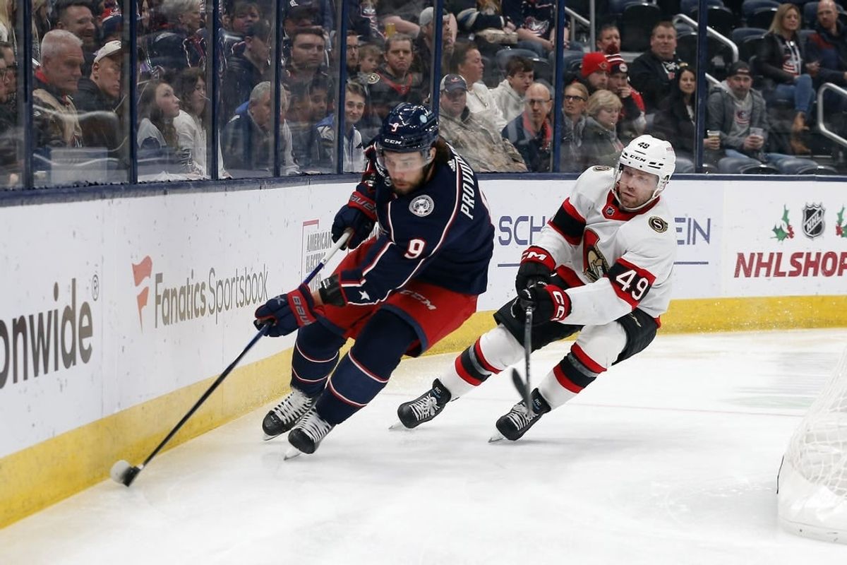 Dec 1, 2023; Columbus, Ohio, USA; Columbus Blue Jackets defenseman Ivan Provorov (9) and Ottawa Senators center Rourke Chartier (49) chase down loose puck during the first period at Nationwide Arena.