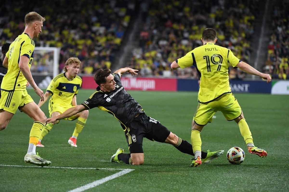 Mar 30, 2024; Nashville, Tennessee, USA; Columbus Crew defender Malte Amundsen (18) kick the ball away from Nashville SC midfielder Alex Muyl (19) in the second half at Geodis Park.