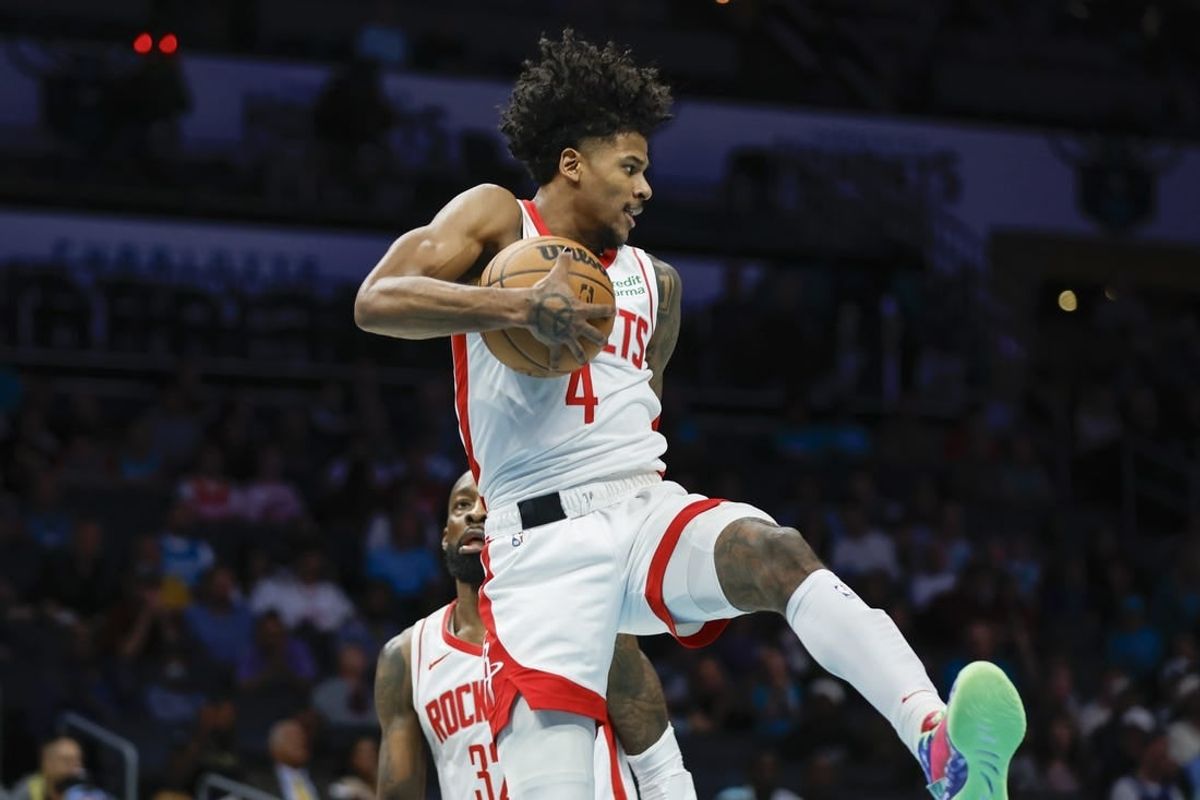 Jan 26, 2024; Charlotte, North Carolina, USA; Houston Rockets guard Jalen Green (4) pulls down a rebound against the Charlotte Hornets during the first quarter at Spectrum Center.