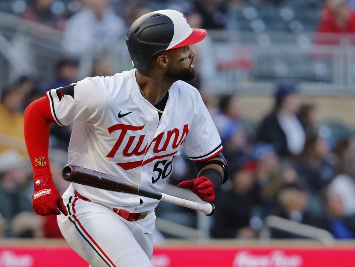 Apr 24, 2024; Minneapolis, Minnesota, USA; Minnesota Twins shortstop Willi Castro (50) tosses his bat as he watches his three-run home run go against the Chicago White Sox in the second inning at Target Field.