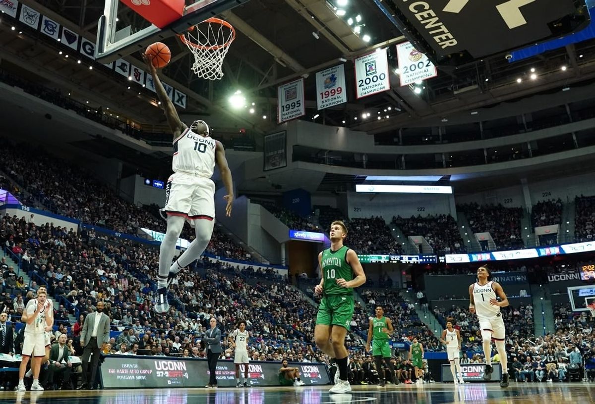 Nov 24, 2023; Hartford, Connecticut, USA; UConn Huskies guard Hassan Diarra (10) steals the ball and makes a basket against the Manhattan Jaspers in the second half at XL Center.