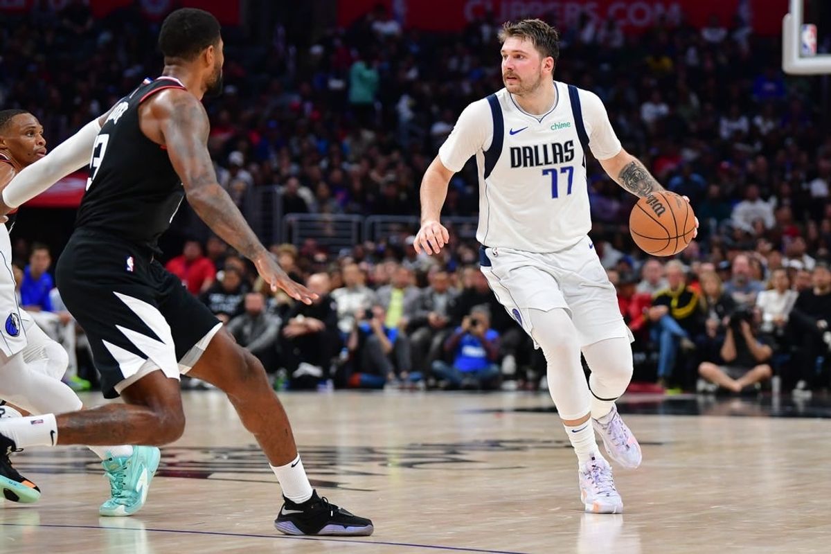 Nov 25, 2023; Los Angeles, California, USA; Dallas Mavericks guard Luka Doncic (77) controls the ball against the Los Angeles Clippers during the second half Crypto.com Arena.