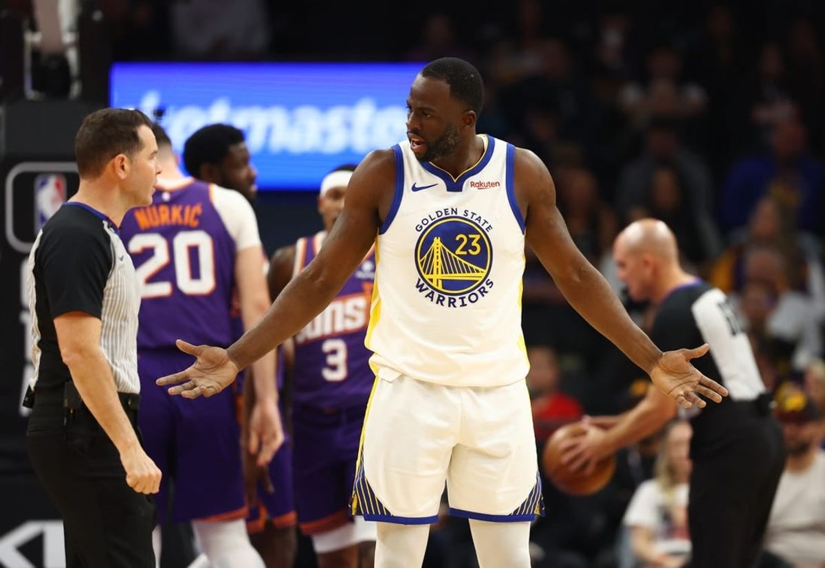 Dec 12, 2023; Phoenix, Arizona, USA; Golden State Warriors forward Draymond Green (23) reacts as he argues with an NBA referee against the Phoenix Suns at Footprint Center.