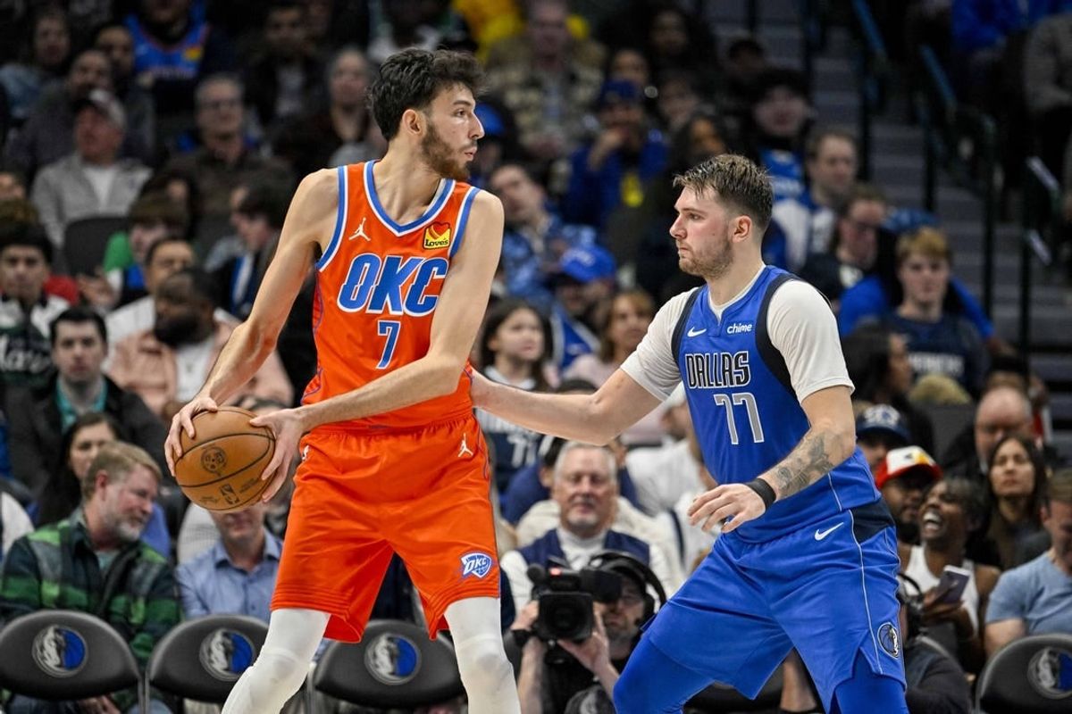 Dec 2, 2023; Dallas, Texas, USA; Oklahoma City Thunder forward Chet Holmgren (7) and Dallas Mavericks guard Luka Doncic (77) in action during the game between the Dallas Mavericks and the Oklahoma City Thunder at the American Airlines Center.