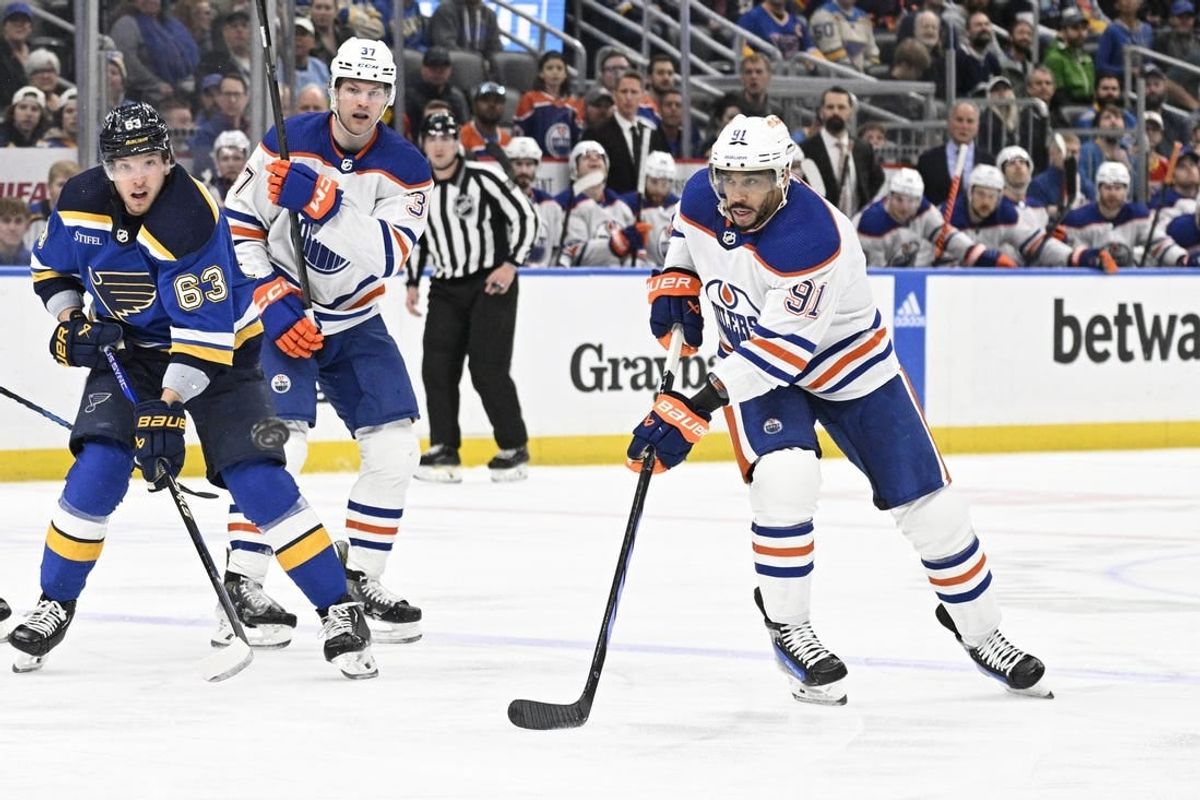 Apr 1, 2024; St. Louis, Missouri, USA; Edmonton Oilers left wing Evander Kane (91) skates against the St. Louis Blues during the first period at Enterprise Center.