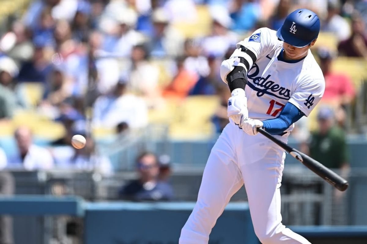 Apr 21, 2024; Los Angeles, California, USA; Los Angeles Dodgers designated hitter Shohei Ohtani (17) his a one run home run against the New York Mets during the third inning at Dodger Stadium.