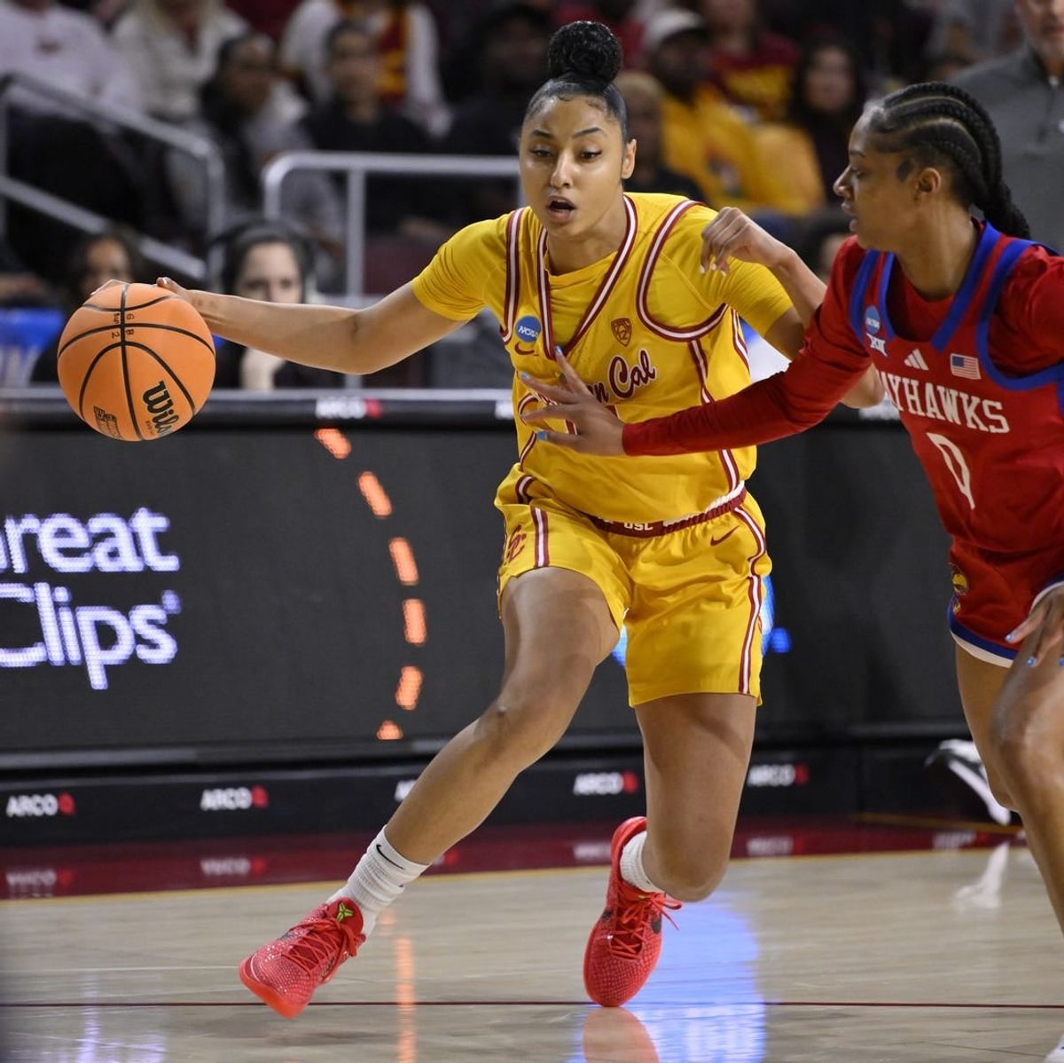 Mar 25, 2024; Los Angeles, CA, USA; USC Trojans guard JuJu Watkins (12) drives to the basket as Kansas Jayhawks guard Wyvette Mayberry (0) defends during an NCAA Women’s Tournament 2nd round game at Galen Center.