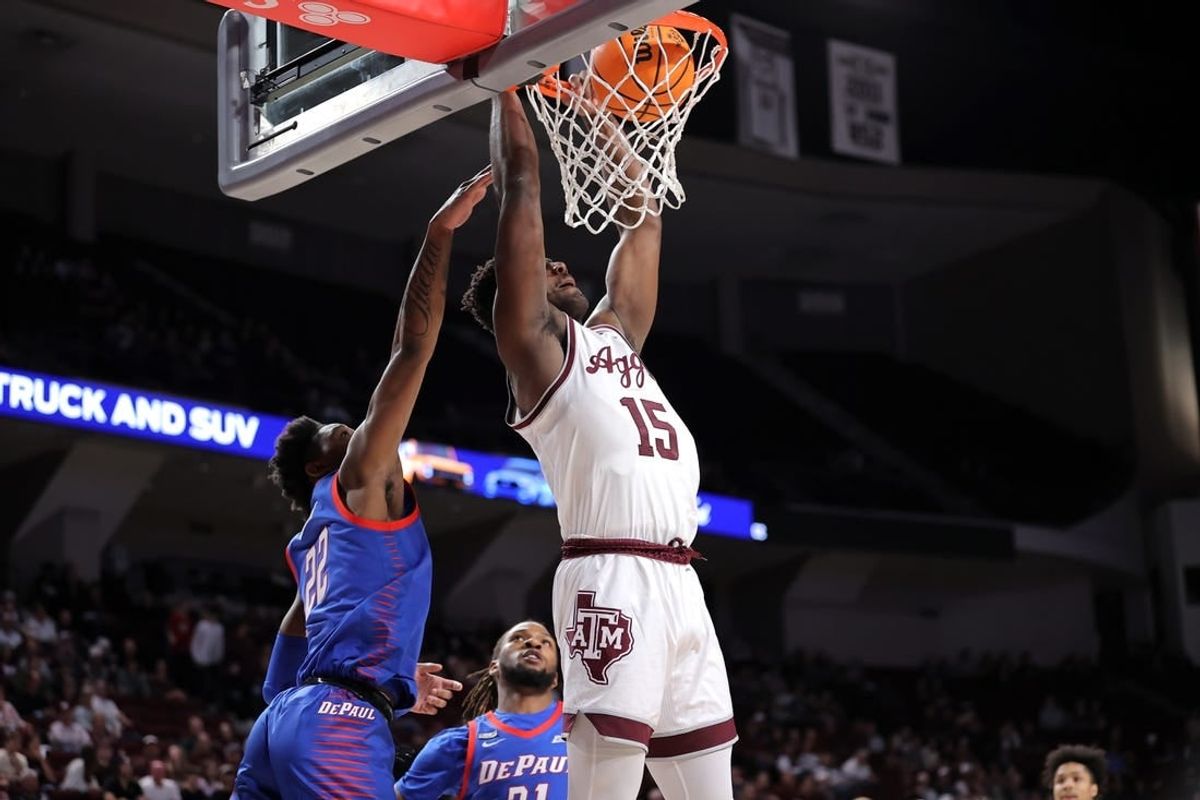 Dec 6, 2023; College Station, Texas, USA; Texas A&M Aggies forward Henry Coleman III (15) dunks against the DePaul Blue Demons during the first half at Reed Arena.