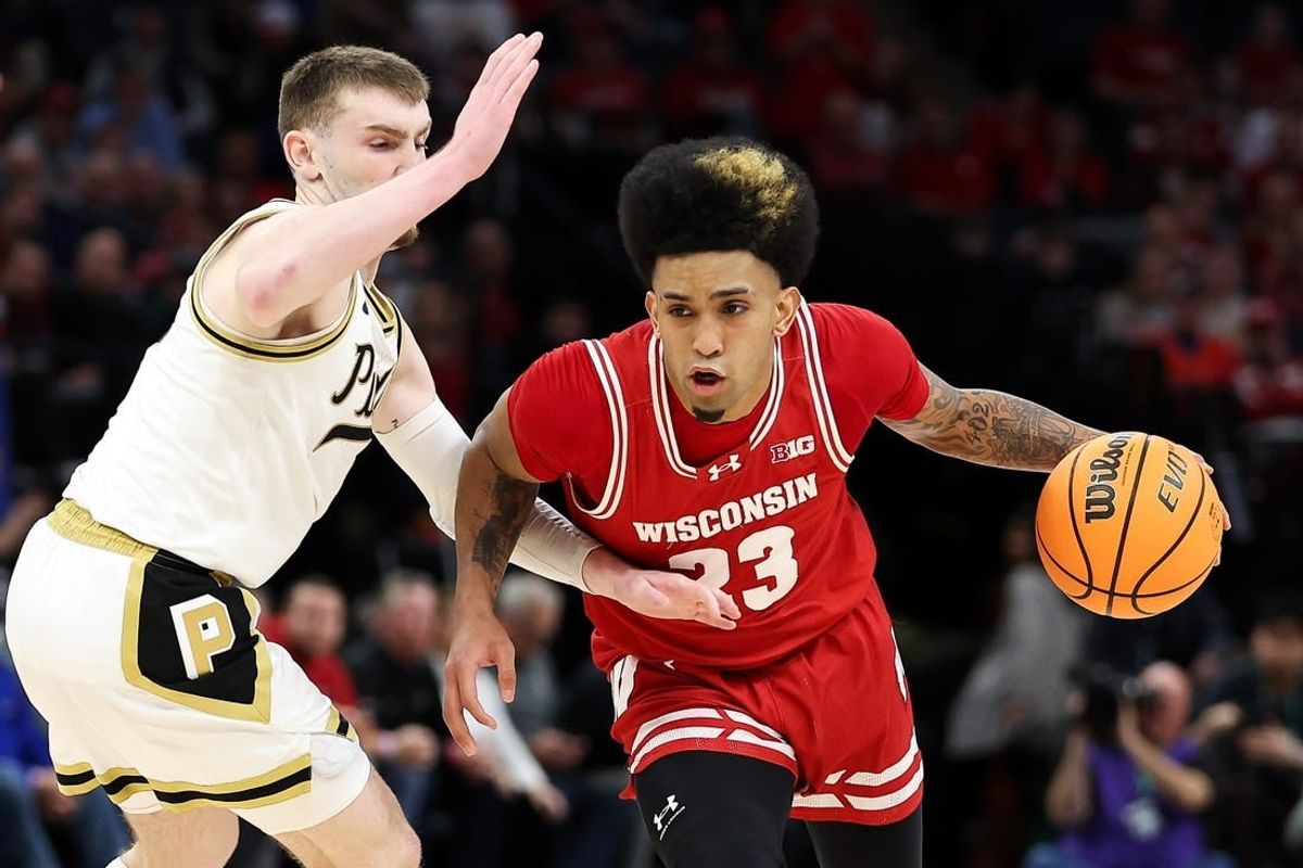Mar 16, 2024; Minneapolis, MN, USA; Wisconsin Badgers guard Chucky Hepburn (23) works around Purdue Boilermakers guard Braden Smith (3) during the second half at Target Center.