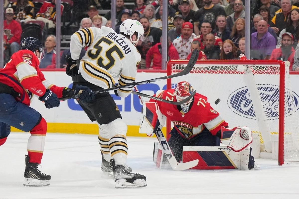 Mar 26, 2024; Sunrise, Florida, USA; Boston Bruins right wing Justin Brazeau (55) takes a shot on goal as Florida Panthers goaltender Sergei Bobrovsky (72) makes a save in the first period at Amerant Bank Arena.