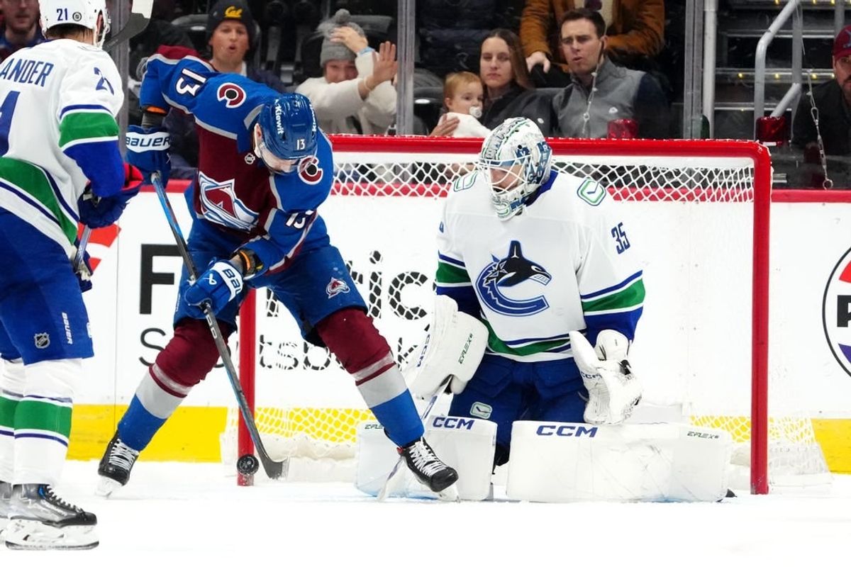 Nov 22, 2023; Denver, Colorado, USA; Colorado Avalanche right wing Valeri Nichushkin (13) shoots the puck at Vancouver Canucks goaltender Thatcher Demko (35) in the first period at Ball Arena.