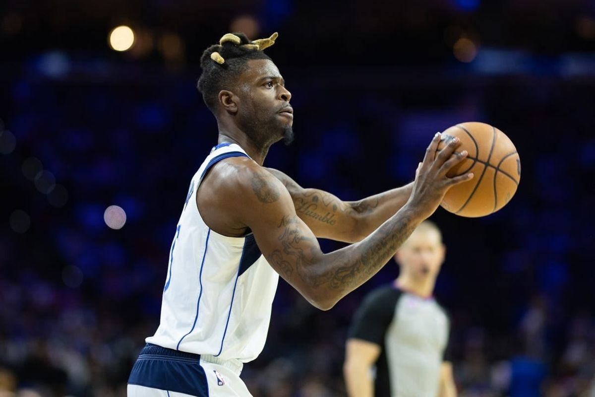 Mar 29, 2023; Philadelphia, Pennsylvania, USA; Dallas Mavericks forward Reggie Bullock (25) shoots the ball against the Philadelphia 76ers during the second quarter at Wells Fargo Center.