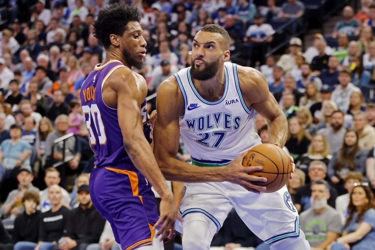Apr 14, 2024; Minneapolis, Minnesota, USA; Minnesota Timberwolves center Rudy Gobert (27) goes to the basket against Phoenix Suns forward Thaddeus Young (30) in the third quarter at Target Center.