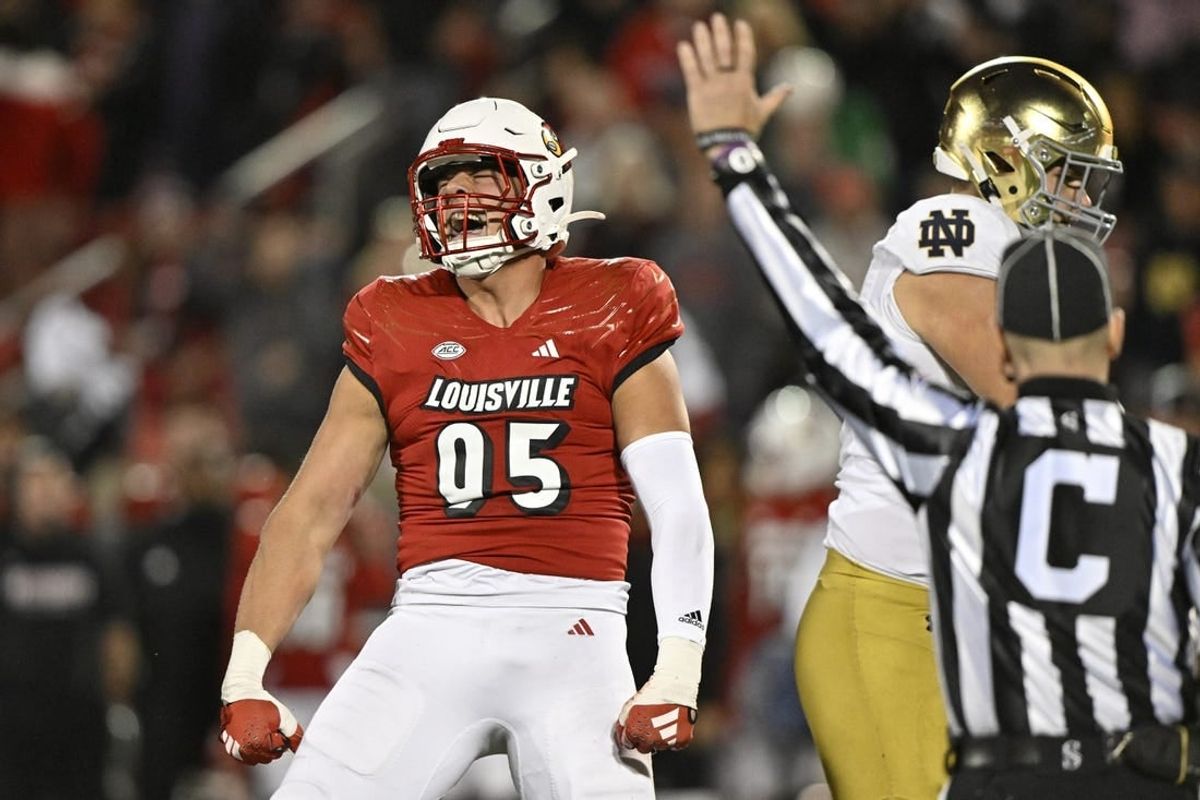 Oct 7, 2023; Louisville, Kentucky, USA;  Louisville Cardinals defensive lineman Mason Reiger (95) reacts after sacking Notre Dame Fighting Irish quarterback Sam Hartman (10) during the first half at L&N Federal Credit Union Stadium.