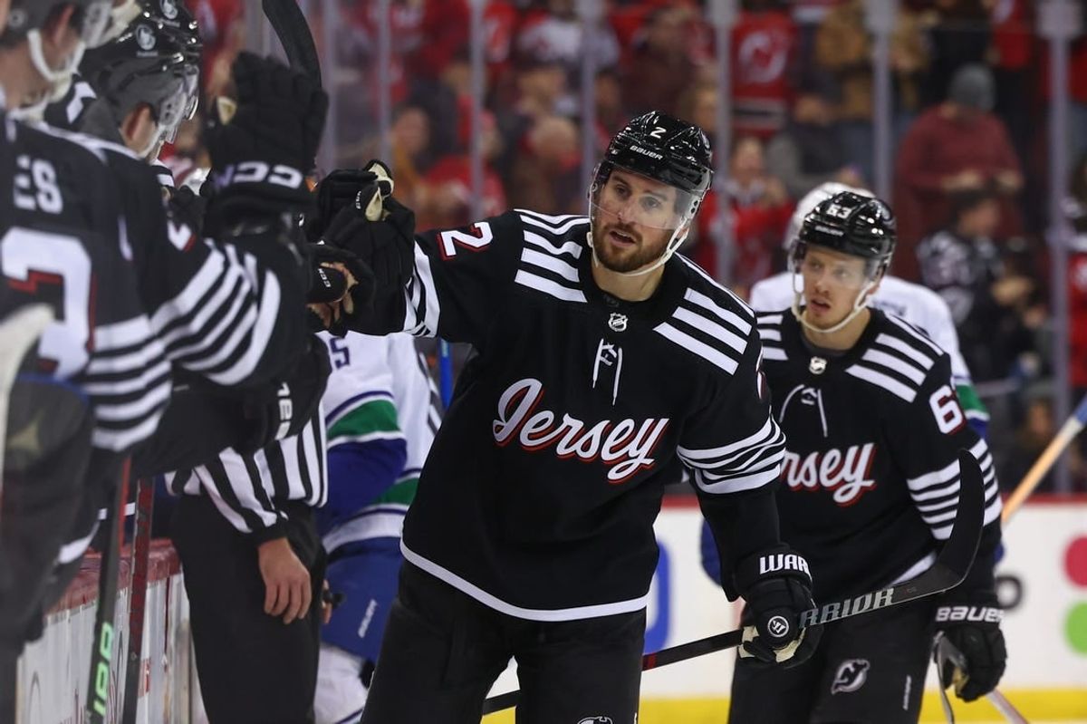 Jan 6, 2024; Newark, New Jersey, USA; New Jersey Devils defenseman Brendan Smith (2) celebrates his goal against the Vancouver Canucks during the third period at Prudential Center.