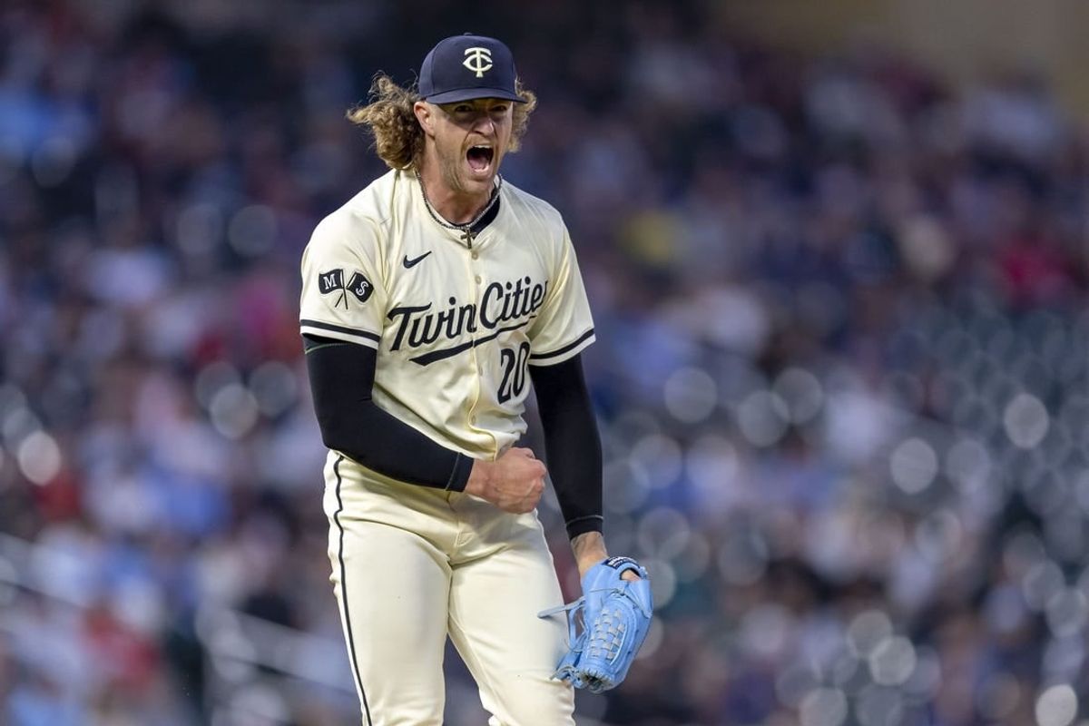 May 3, 2024; Minneapolis, Minnesota, USA; Minnesota Twins starting pitcher Chris Paddack (20) reacts after striking out a Boston Red Sox batter to end the sixth inning at Target Field.