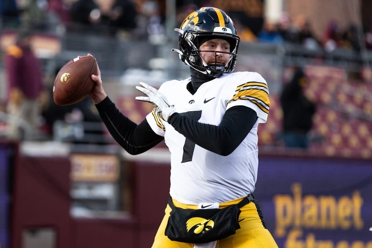 Nov 19, 2022; Minneapolis, Minnesota, USA; Iowa Hawkeyes quarterback Spencer Petras (7) warms up before the game against the Minnesota Golden Gophers at Huntington Bank Stadium.