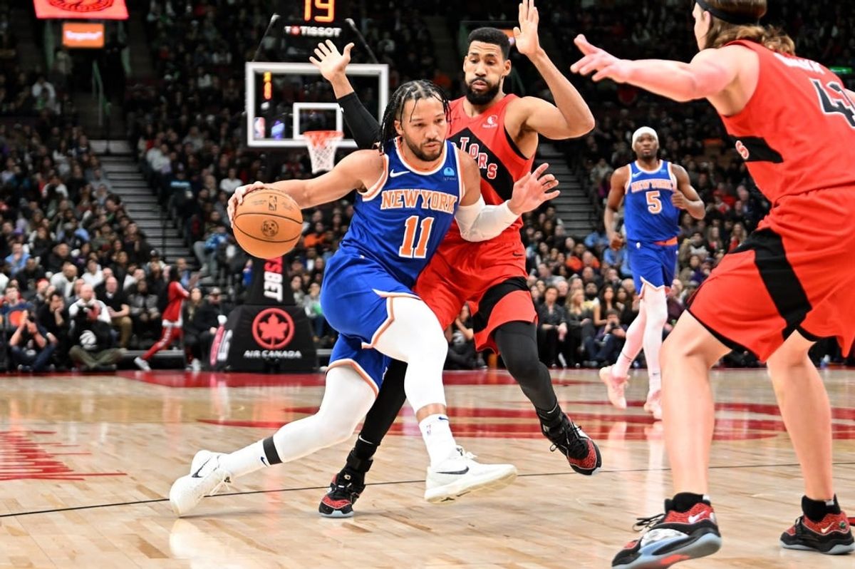 Mar 27, 2024; Toronto, Ontario, CAN;   New York Knicks guard Jalen Brunson (11) dribbles the ball against Toronto Raptors guard Garrett Temple (17) in the first half at Scotiabank Arena.