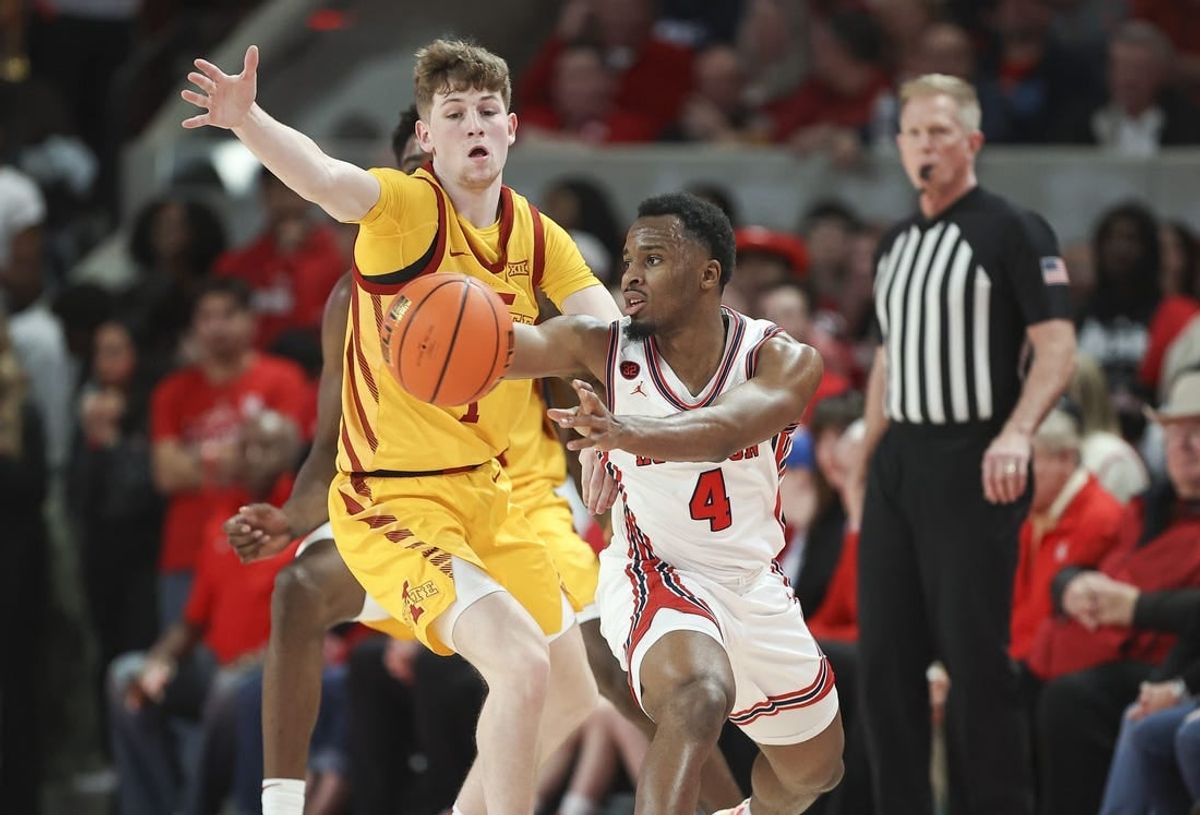 Feb 19, 2024; Houston, Texas, USA; Houston Cougars guard L.J. Cryer (4) passes the ball during the first half against the Iowa State Cyclones at Fertitta Center.