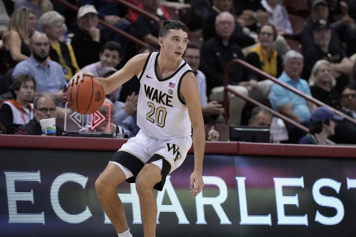 Nov 17, 2023; Charleston, SC, USA; Wake Forest Demon Deacons guard Parker Friedrichsen (20) brings the ball up court in the first half against the Towson Tigers at TD Arena.